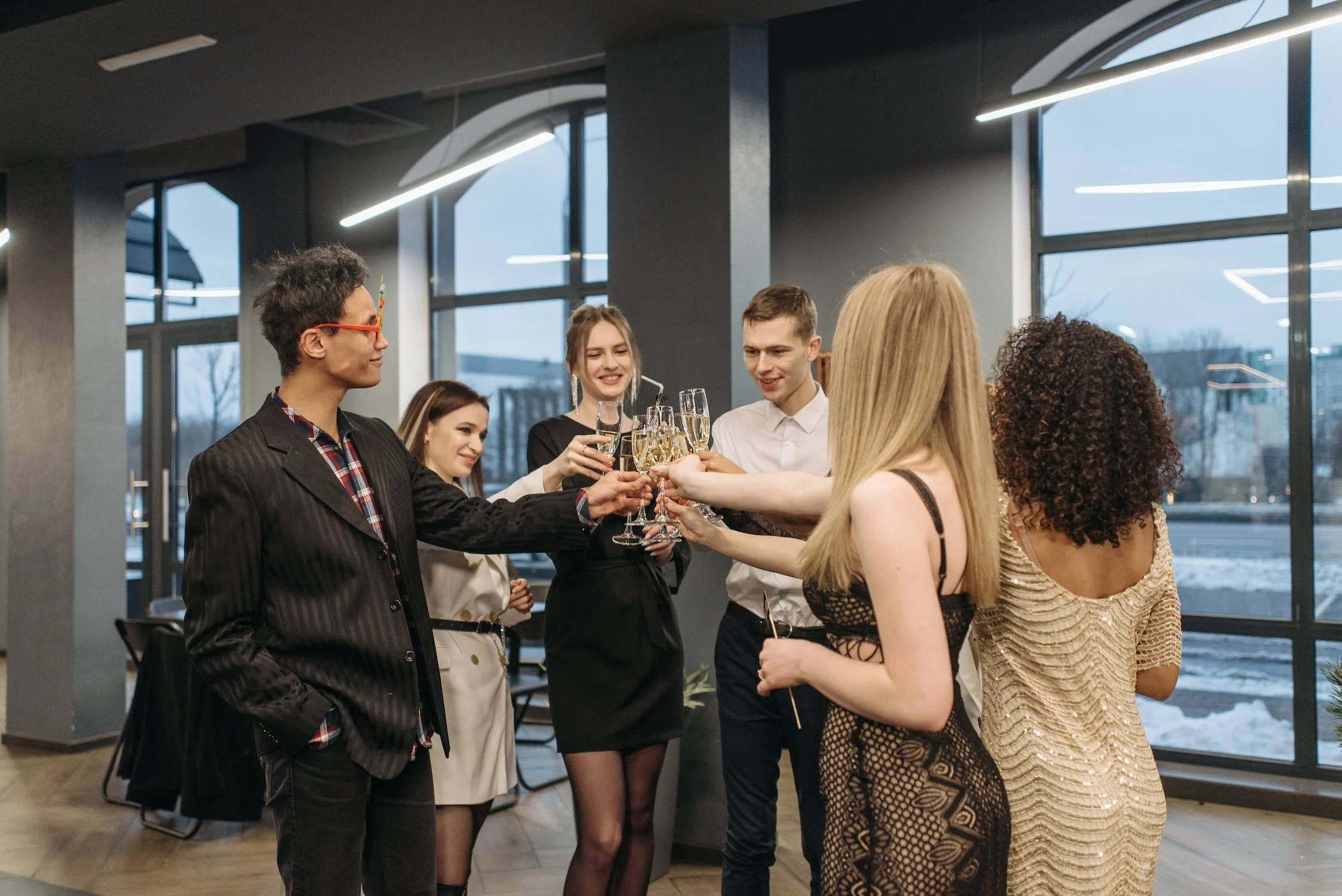 Men and Women toasting in the office